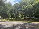 Street view of property, showing home behind a wooden fence at 158 W Magnolia St, Oviedo, FL 32765