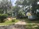 Large backyard with home and storage trailer at 158 W Magnolia St, Oviedo, FL 32765