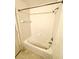 Bathroom with shower/tub combo and tile surround at 2606 Lodi Cir # 105, Kissimmee, FL 34746