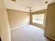 Spacious carpeted bedroom with large window and ceiling fan at 2606 Lodi Cir # 105, Kissimmee, FL 34746