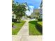 Inviting walkway through a charming community with manicured lawns at 2606 Lodi Cir # 105, Kissimmee, FL 34746