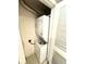 Small laundry area with stacked washer and dryer at 2606 Lodi Cir # 105, Kissimmee, FL 34746