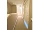 Hallway with carpeted floor and neutral walls at 2606 Lodi Cir # 105, Kissimmee, FL 34746