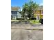Community view showing well-maintained buildings, landscaping, and parking at 2606 Lodi Cir # 105, Kissimmee, FL 34746