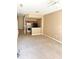 Open living room with carpeted floors and a kitchen with island at 2606 Lodi Cir # 105, Kissimmee, FL 34746