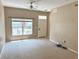 Bright living room with neutral walls and carpet at 2606 Lodi Cir # 105, Kissimmee, FL 34746