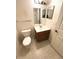 Bathroom featuring a vanity, toilet and mirror at 2606 Lodi Cir # 105, Kissimmee, FL 34746