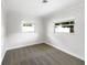 Bright bedroom with grey carpet and two windows at 509 Savona Ct, Altamonte Springs, FL 32701