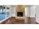 Gathering room with a brick fireplace and hardwood floors at 509 Savona Ct, Altamonte Springs, FL 32701