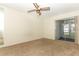 Bedroom with ceiling fan and sliding glass doors to a screened porch at 1264 Village Way, Orlando, FL 32807