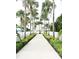 Pathway lined with palm trees leading to a community area at 1864 Caribbean View Ter, Kissimmee, FL 34747