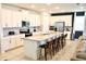 Kitchen with large island and white cabinets at 1864 Caribbean View Ter, Kissimmee, FL 34747