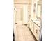 Clean bathroom with a bathtub, toilet and double vanity at 1864 Caribbean View Ter, Kissimmee, FL 34747