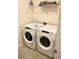 Convenient laundry room with Whirlpool washer and dryer at 1864 Caribbean View Ter, Kissimmee, FL 34747