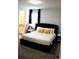 Spacious bedroom with king-size bed and ensuite bathroom at 1864 Caribbean View Ter, Kissimmee, FL 34747