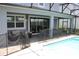 Relaxing pool area with safety fence and patio at 1864 Caribbean View Ter, Kissimmee, FL 34747