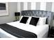 Primary bedroom with plush bed and modern decor at 1864 Caribbean View Ter, Kissimmee, FL 34747