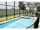 Relaxing screened pool and spa with lounge chairs at 1864 Caribbean View Ter, Kissimmee, FL 34747