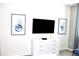 Bedroom with TV, dresser, and wall art at 1864 Caribbean View Ter, Kissimmee, FL 34747