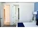 Bedroom with two doors, one leading to another room at 1864 Caribbean View Ter, Kissimmee, FL 34747