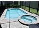 Screened pool and spa with brick pavers at 1864 Caribbean View Ter, Kissimmee, FL 34747