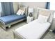 Two twin beds with stylish frames in a bedroom at 1864 Caribbean View Ter, Kissimmee, FL 34747