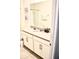Clean bathroom with white cabinets and a large mirror at 1864 Caribbean View Ter, Kissimmee, FL 34747