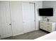 Bright bedroom with a large closet and TV at 1864 Caribbean View Ter, Kissimmee, FL 34747