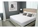 Spacious bedroom with a large bed and grey decor at 1864 Caribbean View Ter, Kissimmee, FL 34747