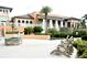 Community area with fire pit, seating, and nearby clubhouse at 1864 Caribbean View Ter, Kissimmee, FL 34747