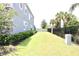 Landscaped side yard with a privacy fence and a spacious lawn area at 1864 Caribbean View Ter, Kissimmee, FL 34747