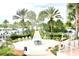 Resort-style pool area with lush landscaping and fire pit at 1864 Caribbean View Ter, Kissimmee, FL 34747
