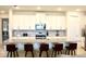 Kitchen with large island and white cabinets at 1864 Caribbean View Ter, Kissimmee, FL 34747