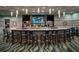 Upscale community bar with a large, curved bar top at 1411 Clubman Dr, Davenport, FL 33896