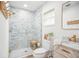 Updated bathroom with a walk-in shower, marble tile, and modern fixtures at 11130 Park Ave, Windermere, FL 34786