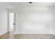 Bright and airy bedroom with hardwood floors and an ensuite bathroom at 11130 Park Ave, Windermere, FL 34786