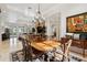 Spacious dining room with a large table and view of the living room at 11261 Macaw Ct, Windermere, FL 34786