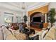 Bright living room with a fireplace and comfortable seating at 11261 Macaw Ct, Windermere, FL 34786