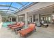 Relaxing pool area with lounge chairs and screened enclosure at 11261 Macaw Ct, Windermere, FL 34786
