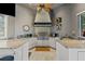 Outdoor kitchen with granite countertops and built-in grill at 11261 Macaw Ct, Windermere, FL 34786