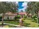 Luxury home with tile roof, landscaping, and walkway at 11261 Macaw Ct, Windermere, FL 34786