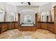 Elegant bathroom with soaking tub, double vanity, and walk-in shower at 11261 Macaw Ct, Windermere, FL 34786