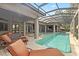 Luxury pool and spa with screened enclosure and lake views at 11261 Macaw Ct, Windermere, FL 34786