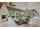 Relaxing outdoor space with seating, fireplace and pool views at 11261 Macaw Ct, Windermere, FL 34786