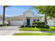 Charming one-story home with gray stone accents at 1411 Clubman Dr, Davenport, FL 33896