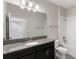 Clean bathroom with granite countertop and bathtub at 1411 Clubman Dr, Davenport, FL 33896