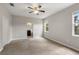 Large main bedroom with carpet flooring and en-suite bathroom access at 1411 Clubman Dr, Davenport, FL 33896