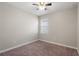 Bright bedroom with neutral walls and carpet flooring at 1411 Clubman Dr, Davenport, FL 33896