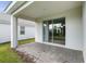 Private patio with sliding glass doors at 1411 Clubman Dr, Davenport, FL 33896