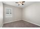 Charming bedroom with neutral walls and carpet flooring at 1411 Clubman Dr, Davenport, FL 33896